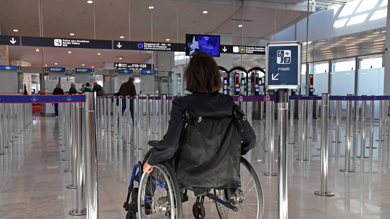 Person in a wheelchair at an airport accessibility checkpoint